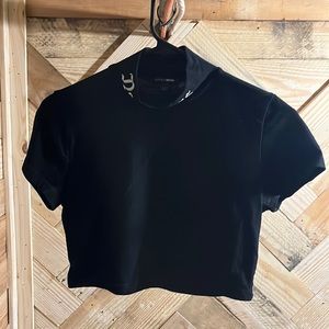 Black crop top kneck says "not yours"